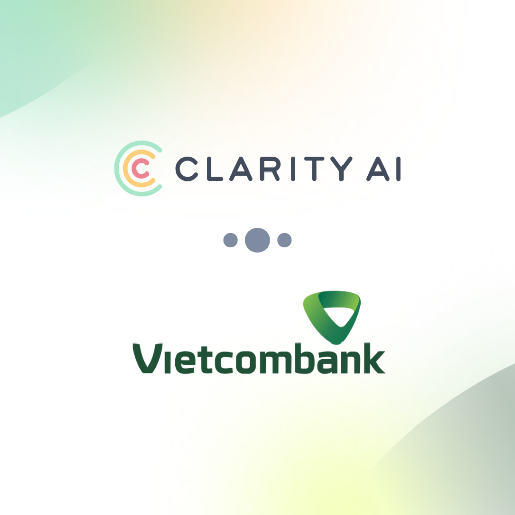 I loghi Clarity AI Vietcombank, separati da tre puntini, su uno sfondo con una sfumatura delicata: probabilmente si tratta di una presentazione di una collaborazione o di una partnership.